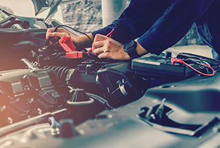 Mechanic checking engine